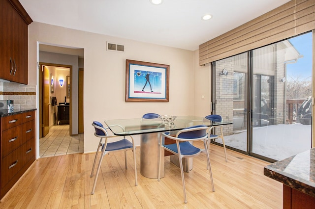 dining space featuring recessed lighting, baseboards, light wood finished floors, and visible vents