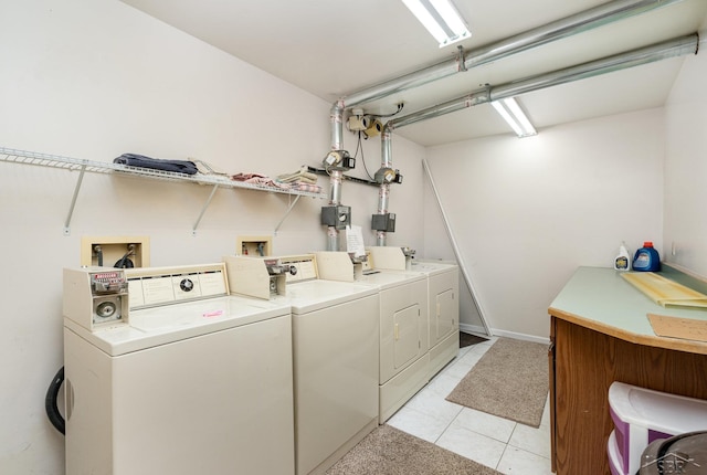 common laundry area featuring light tile patterned flooring and independent washer and dryer