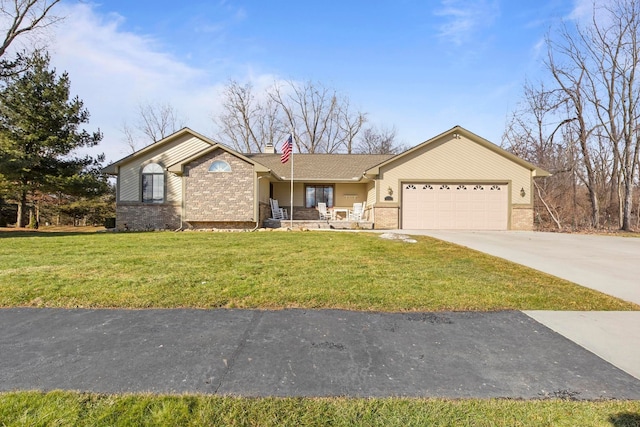 view of front of property featuring brick siding, a porch, concrete driveway, a front yard, and an attached garage