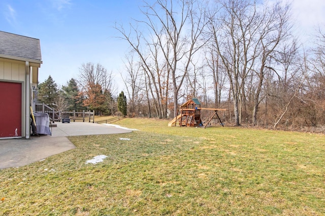 view of yard featuring a patio and a playground