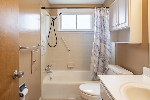 bathroom with shower / tub combo, vanity, and toilet