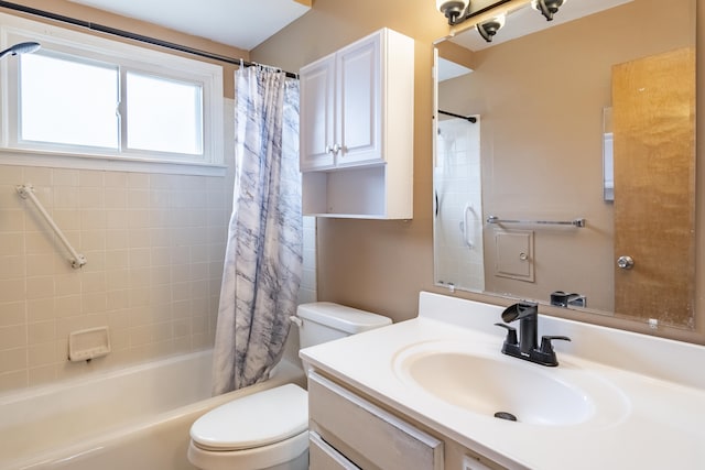 bathroom featuring shower / bath combo, vanity, and toilet