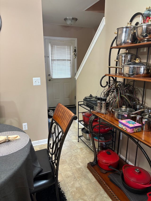 dining space featuring baseboards