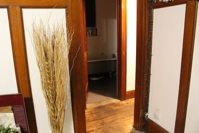 hallway with wood finished floors