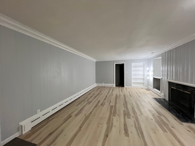 unfurnished living room featuring a fireplace, ornamental molding, baseboard heating, and wood finished floors