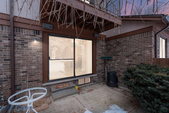 exterior space with brick siding