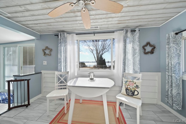 dining space featuring visible vents, wooden ceiling, and a ceiling fan