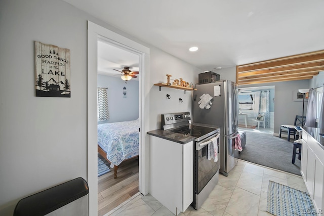 kitchen with open shelves, appliances with stainless steel finishes, dark countertops, and recessed lighting