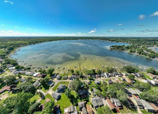 bird's eye view with a residential view and a water view