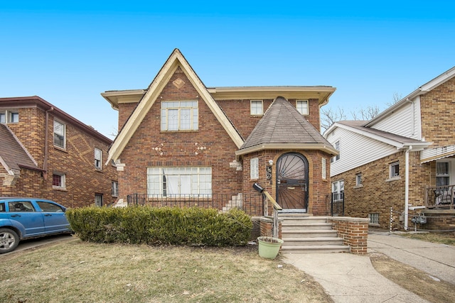 16636 Sorrento St, Detroit, MI 48235 - tudor house featuring brick siding and roof with shingles
