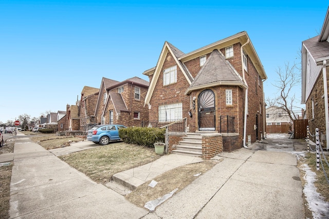 16636 Sorrento St, Detroit, MI 48235 - view of front of home featuring brick siding, driveway, and fence