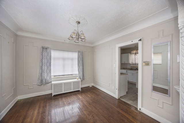 16636 Sorrento St, Detroit, MI 48235 - empty room featuring radiator, baseboards, a chandelier, hardwood / wood-style floors, and a textured ceiling