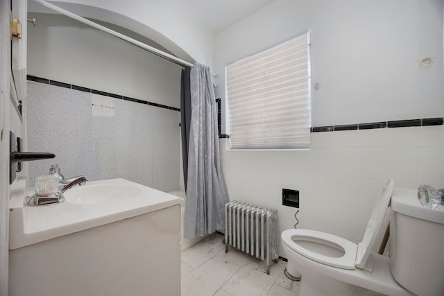 16636 Sorrento St, Detroit, MI 48235 - full bathroom featuring tile walls, vanity, toilet, and radiator heating unit