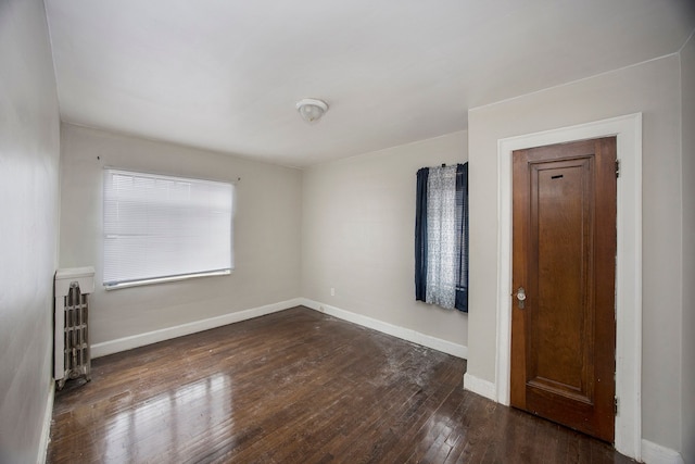 16636 Sorrento St, Detroit, MI 48235 - unfurnished room with dark wood-style floors and baseboards