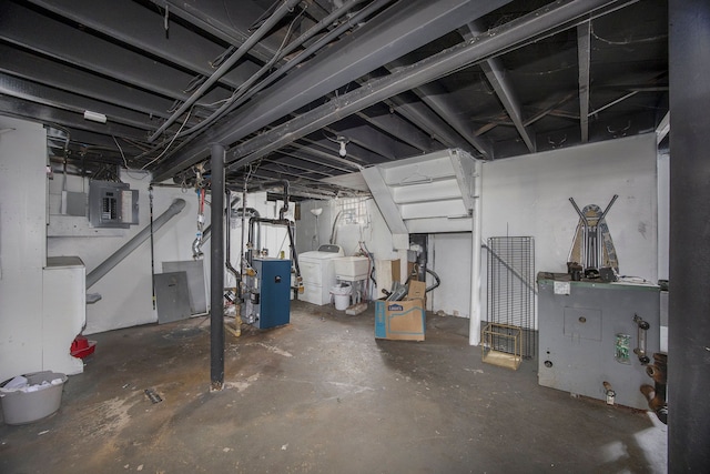 16636 Sorrento St, Detroit, MI 48235 - unfinished basement with electric panel, a heating unit, and washing machine and clothes dryer