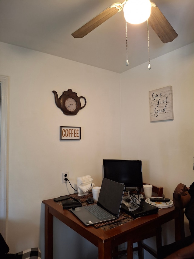 office space featuring a ceiling fan