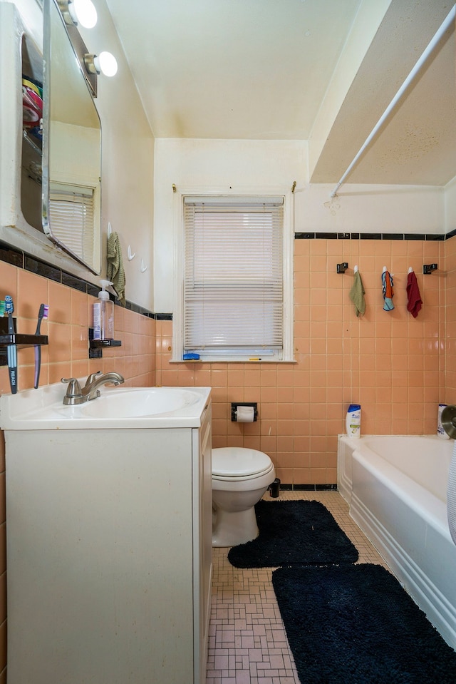 14927 Fairmount Dr, Detroit, MI 48205 - bathroom with vanity, bathtub / shower combination, wainscoting, tile walls, and toilet