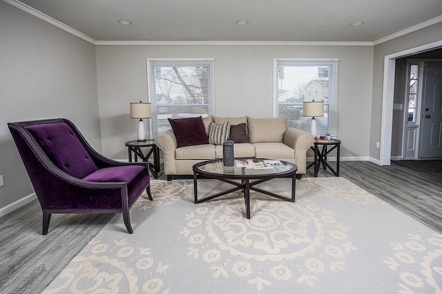 living room featuring ornamental molding, plenty of natural light, and wood finished floors