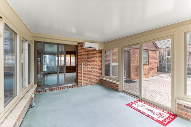 unfurnished sunroom with an AC wall unit