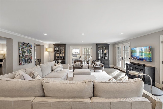 living area featuring ornamental molding, recessed lighting, french doors, and baseboards