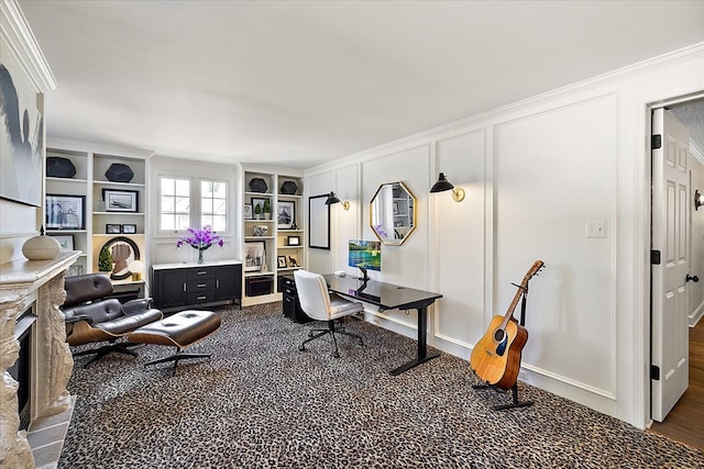 office space with ornamental molding and a decorative wall