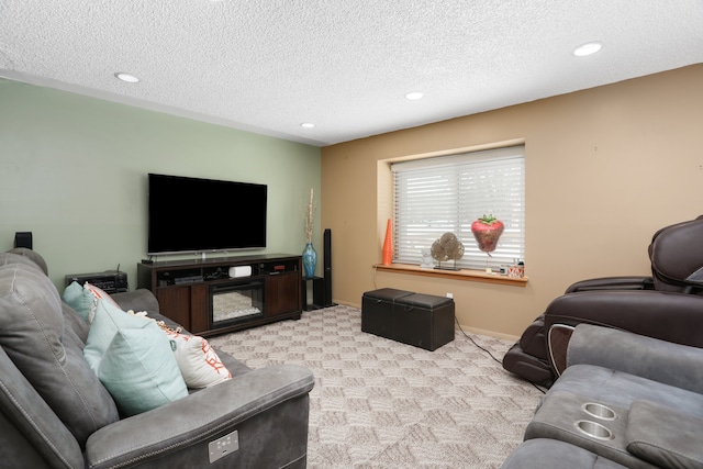 living area featuring carpet, baseboards, a textured ceiling, and recessed lighting