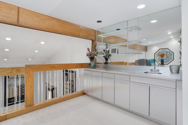 interior space with concrete floors, vanity, and recessed lighting