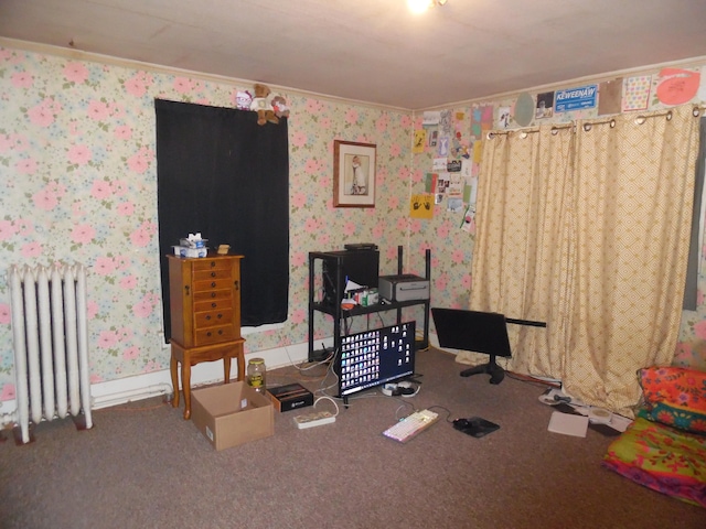 carpeted bedroom with wallpapered walls, ornamental molding, and radiator