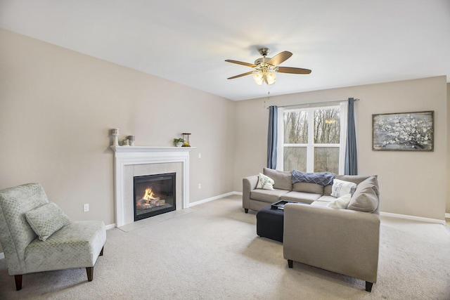 living area with light colored carpet, a fireplace, and baseboards