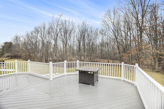 deck featuring a lawn