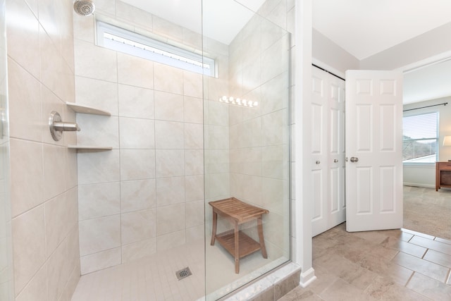 full bath featuring a tile shower