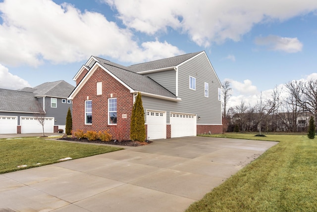 view of side of property with concrete driveway, brick siding, a yard, and roof with shingles