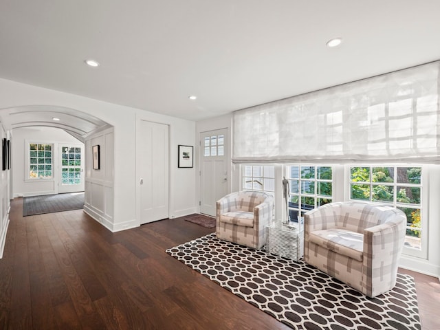 300 Warren Ct, Birmingham, MI 48009 - living room featuring arched walkways, wood finished floors, recessed lighting, and baseboards