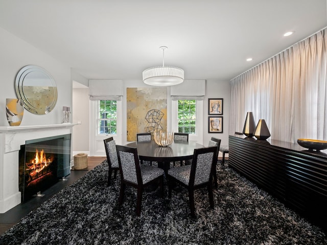 300 Warren Ct, Birmingham, MI 48009 - dining area featuring a glass covered fireplace, healthy amount of natural light, recessed lighting, and wood finished floors