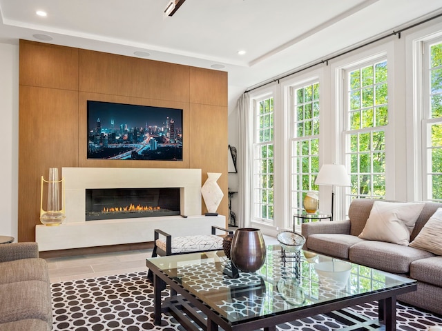 300 Warren Ct, Birmingham, MI 48009 - tiled living room with a fireplace and recessed lighting