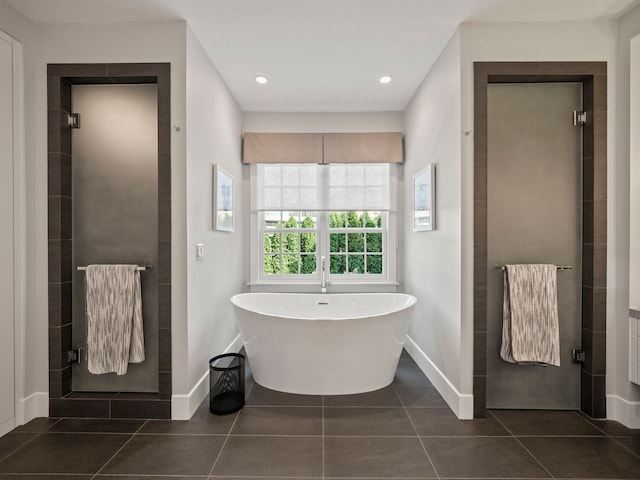 300 Warren Ct, Birmingham, MI 48009 - bathroom featuring baseboards, a stall shower, a soaking tub, tile patterned floors, and recessed lighting