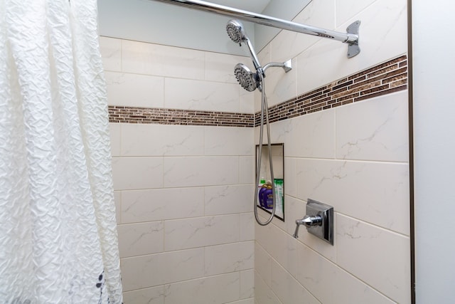 full bathroom with tiled shower