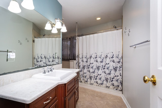 full bathroom featuring baseboards, a shower with curtain, vanity, and tile patterned floors