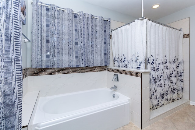 bathroom featuring tile patterned flooring, a garden tub, curtained shower, and recessed lighting