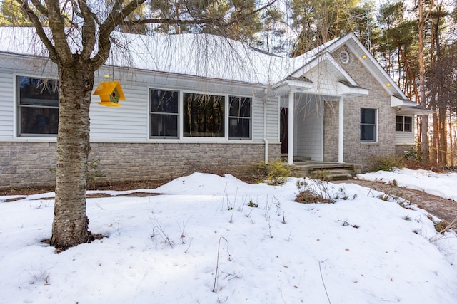 view of front of property featuring stone siding