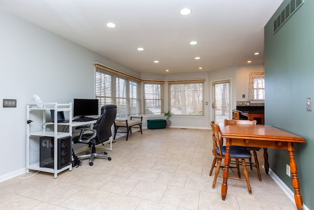 home office with a healthy amount of sunlight, baseboards, visible vents, and recessed lighting