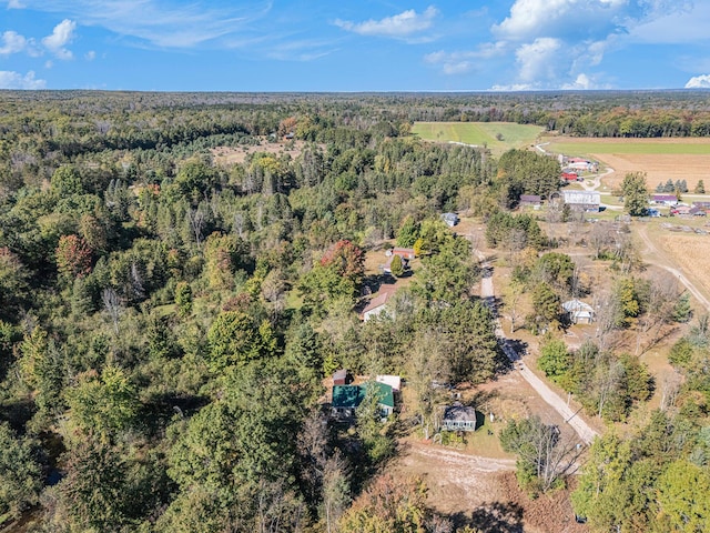 birds eye view of property with a forest view