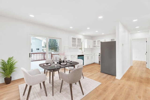 dining area featuring baseboards, recessed lighting, and light wood-style floors