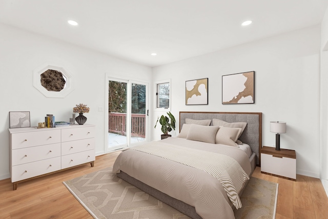 bedroom featuring light wood-style floors, access to outside, and recessed lighting