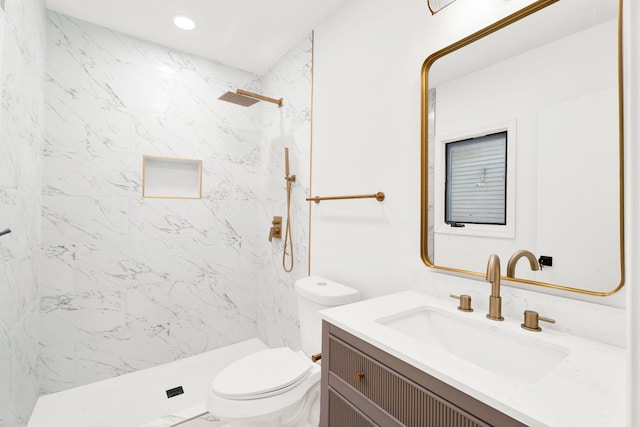 bathroom featuring a shower, vanity, toilet, and recessed lighting