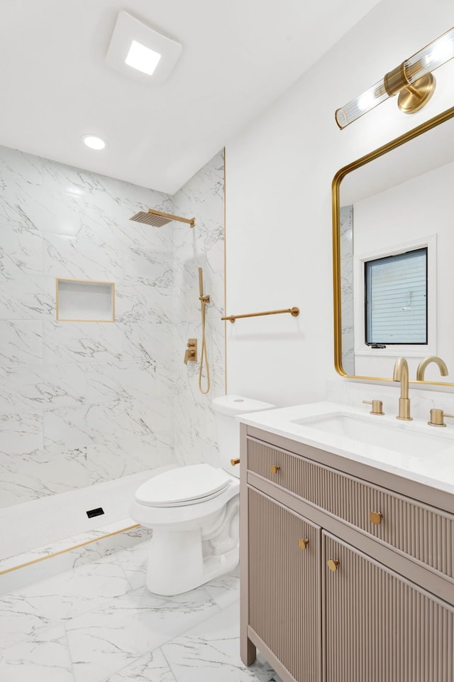 bathroom featuring marble finish floor, a marble finish shower, recessed lighting, toilet, and vanity