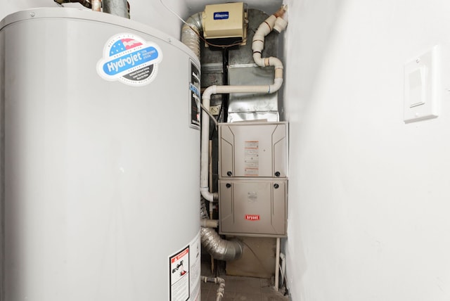 utility room featuring water heater