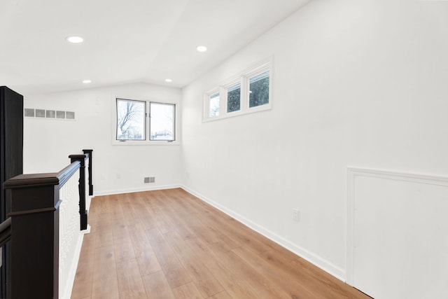 interior space with light wood-type flooring, visible vents, baseboards, and recessed lighting