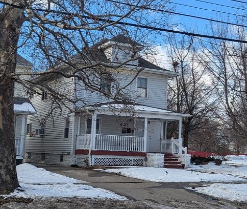 traditional style home featuring covered porch