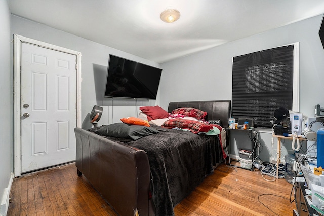 bedroom with hardwood / wood-style flooring